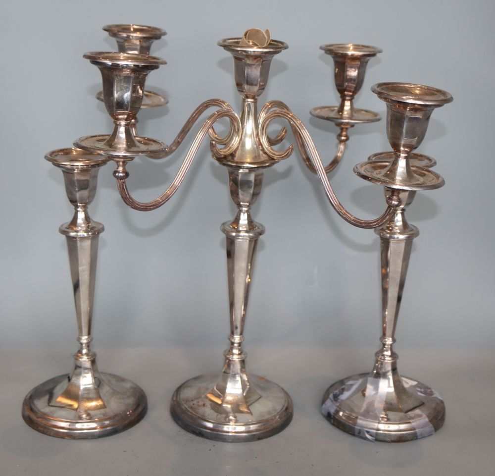 A pair of 1960s silver candlesticks by Roberts & Belk, Sheffield, 1968, 25.4cm, weighted & a candelabrum.